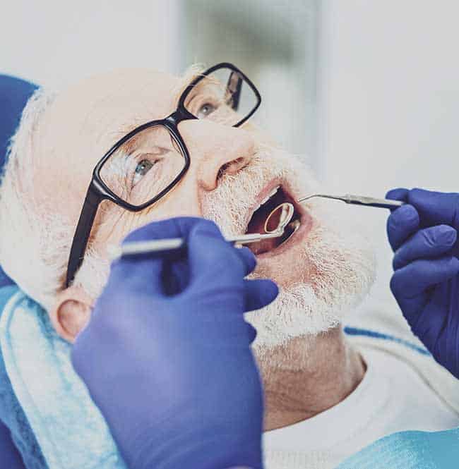 Older man getting dental check-up